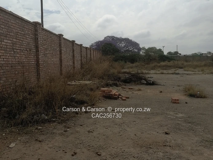 8001m² Walled Commercial Land — Main Road, Ardbennie, Harare South