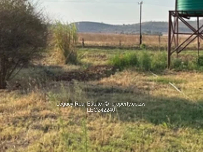 Orange Grove  Land with Incomplete House and a Cottage – Chinhoyi | 9,900m² Stand