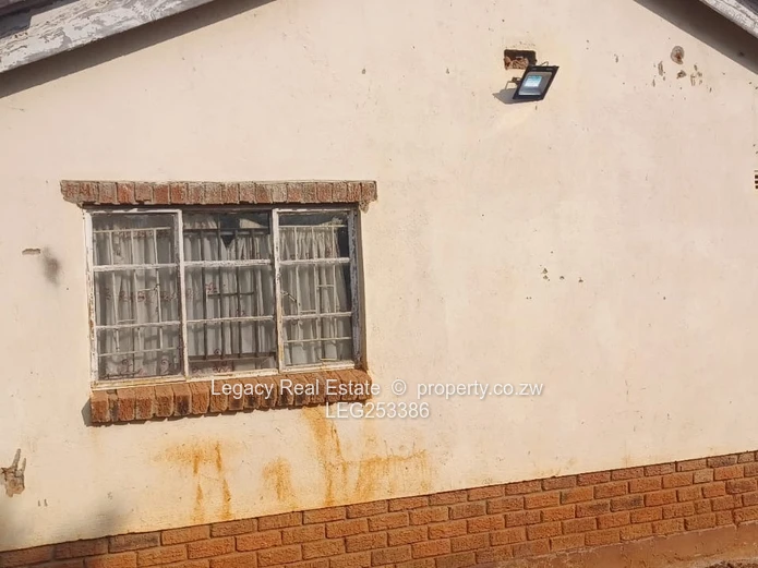 Walled 2-Bed Home on 2300m² with Verandah & Main Road Frontage (Sole Mandate)
