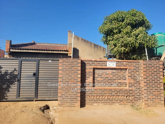 A neat 7-roomed, 4-bedroom house sitting on 200m², ideal for a family or as an investment property.