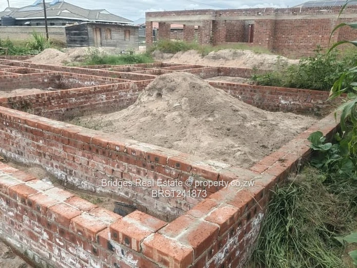 Serviced Residential Stand for Sale with Unfinished Structure