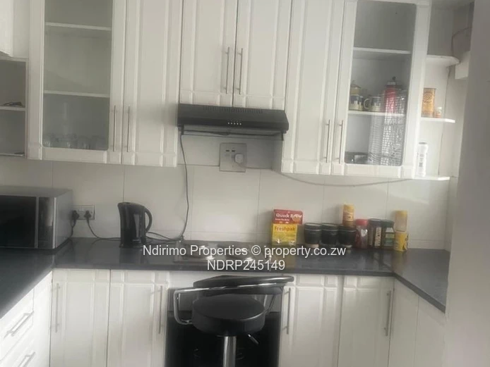 Secure 2-Bed Harare CBD Flat with Balcony, Garden & Modern Kitchen