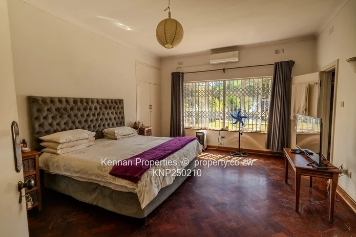 Attractive five bedroom home on two and a half acres. Good water and Msasa trees. (Sole Mandate)