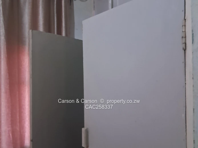 Mufakose 2 bedroom flat lounge fitted kitchen combined toilet and bathroom on ground floor 