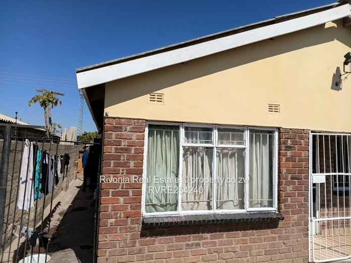 Walled 4-Bed Brick Home in Chitungwiza — Secure Verandah