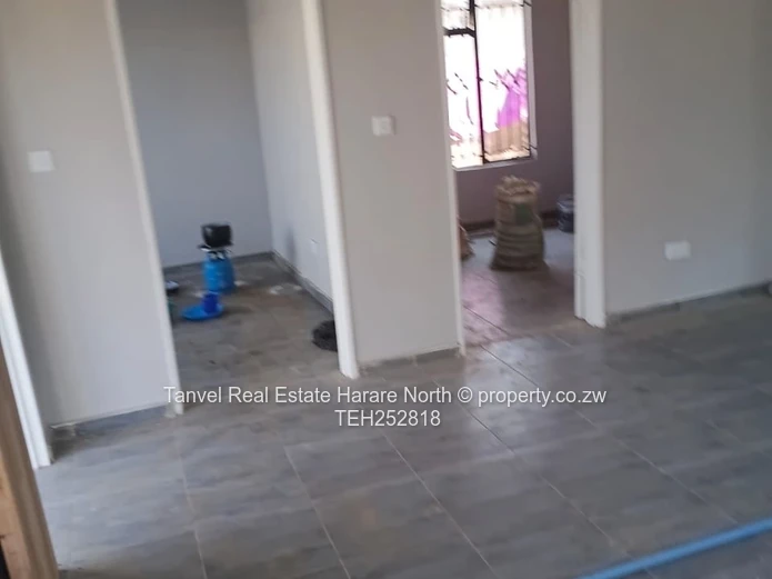 Available for Sale in Warren Park D is a neatly refurbished house with 5 Bedrooms, Lounge and kitche