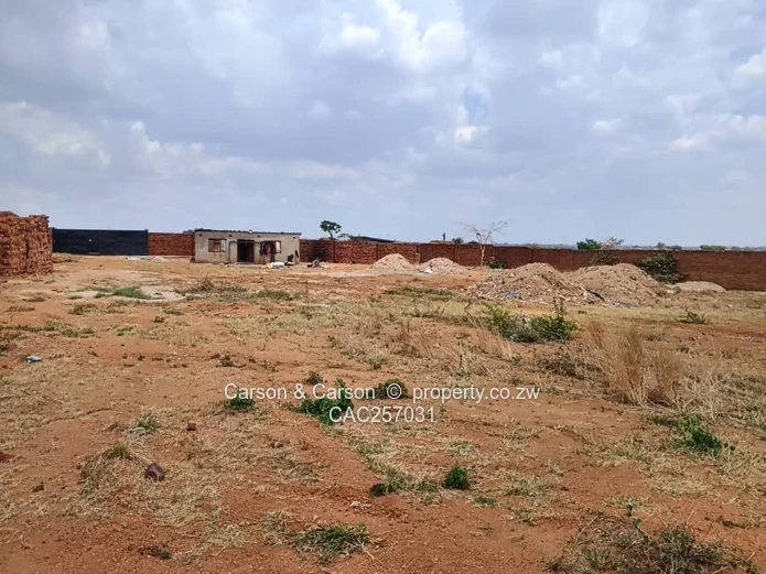 Walled 3800 m² Industrial Site in Chitungwiza — Gate & Gravel Access