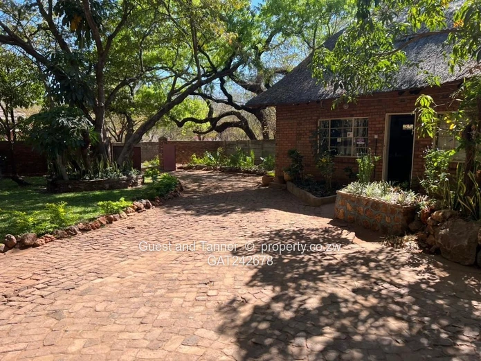 Ten bedroomed lodge under thatch for sale 