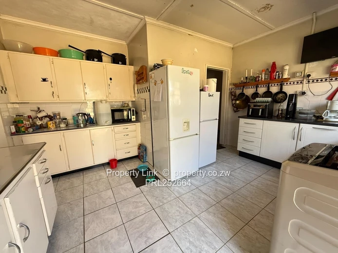 Double Entrance Corner Property With Potential!