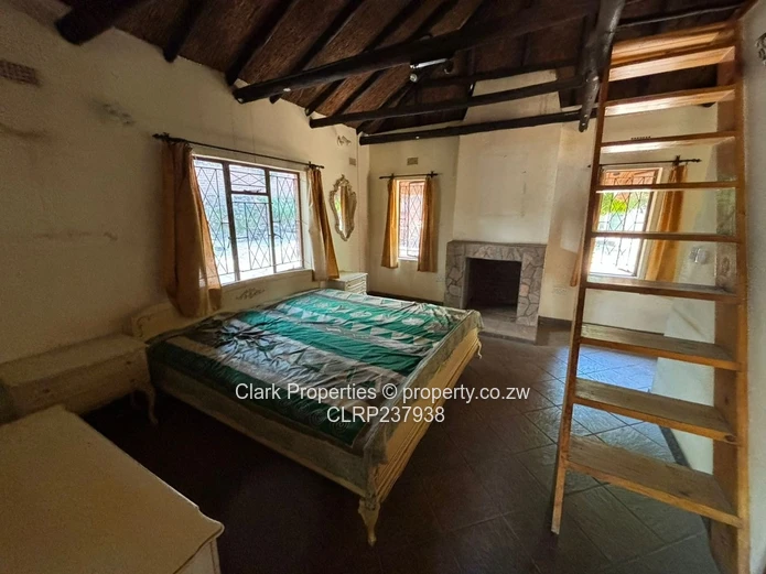 Spacious One-Acre Property with Unique Thatched Residence