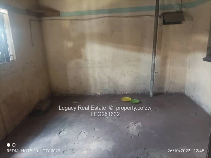 Tiled, High-Ceiling Retail Shop with Service Hatch — Chitungwiza