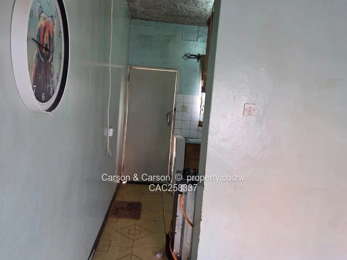Mufakose 2 bedroom flat lounge fitted kitchen combined toilet and bathroom on ground floor 