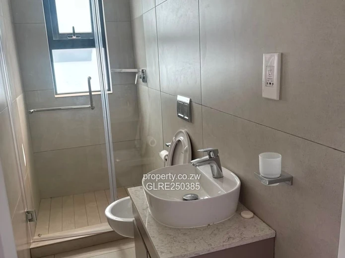 Contemporary 4-Bed Borrowdale Apt — Balcony & Borehole
