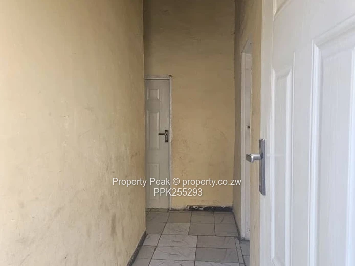 11-Bedroom Brick Home in Mbare — Walled, Main Road Deeds available
