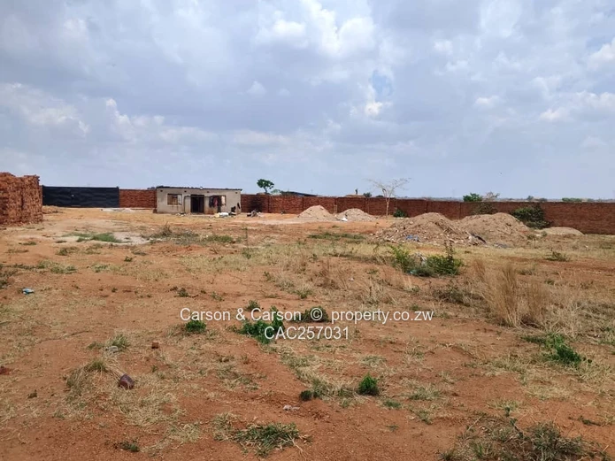 Walled 3800 m² Industrial Site in Chitungwiza — Gate & Gravel Access