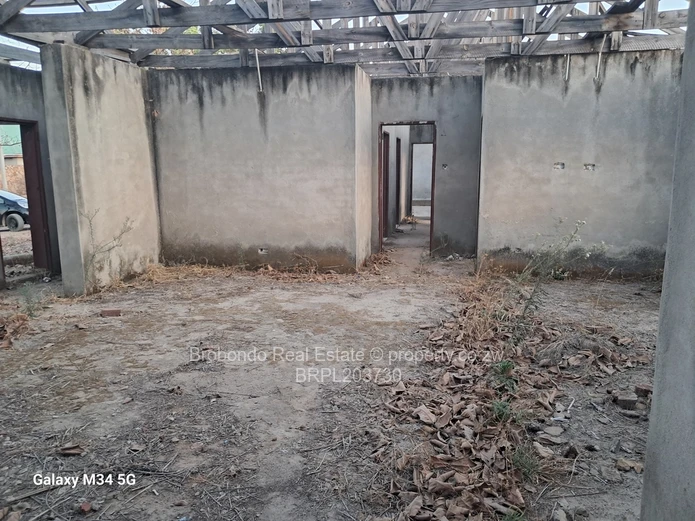 Incomplete house on roof level. 