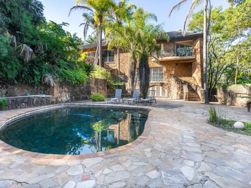 Large Home Nestled in a Lush 13 acre Tranquil Setting