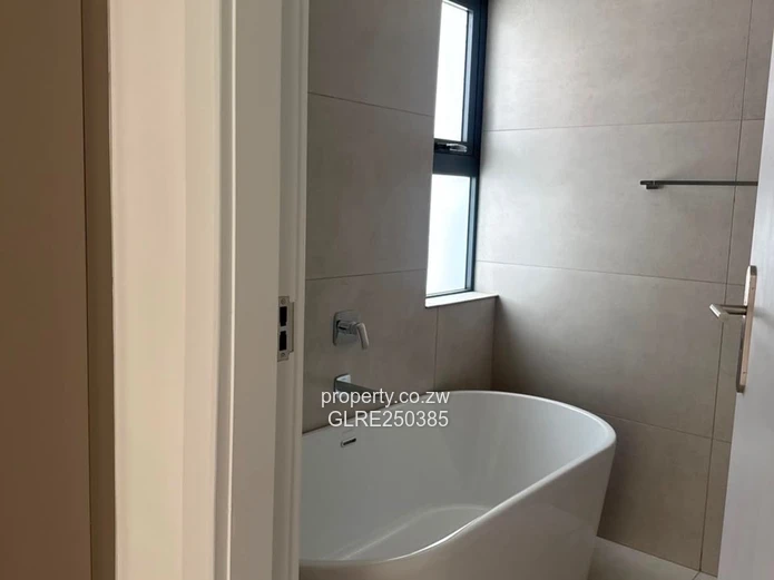 Contemporary 4-Bed Borrowdale Apt — Balcony & Borehole