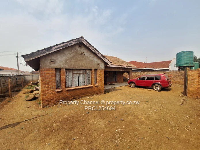 Solid 4-Bedroom Brick Home with Potential