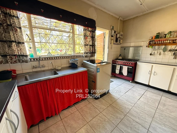 Double Entrance Corner Property With Potential!
