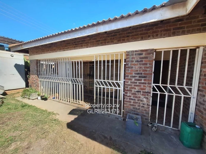 Brick 4-Bed Home — Verandah, Water Tank & Walled Yard