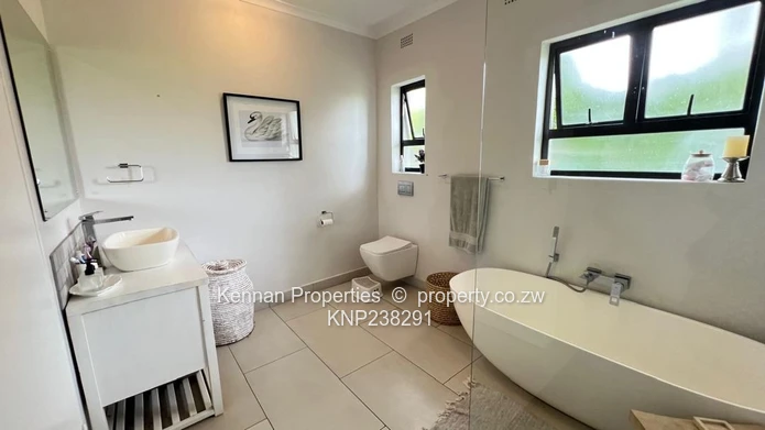 Stunning partly double storey home in Borrowdale Brooke Golf Estate overlooking the 18th Fairway. 