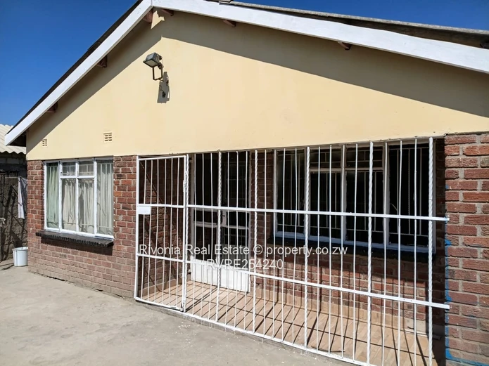 Walled 4-Bed Brick Home in Chitungwiza — Secure Verandah