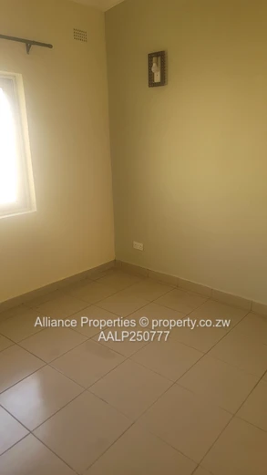 Spacious 2-Bed Ground Floor Flat with Borehole & Garden
