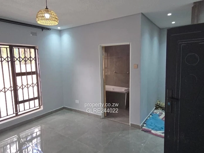 Paved Red-Brick 2-Bed Home with Borehole in Mabelreign