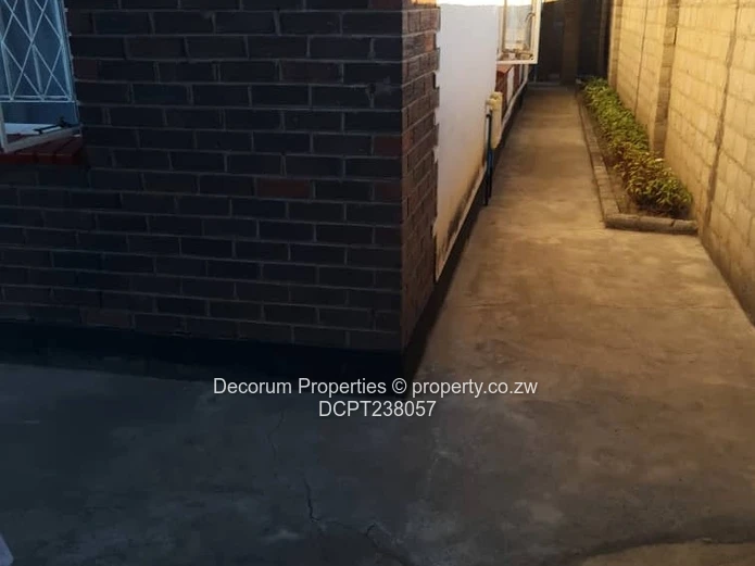 Chitungwiza: 2-Bed, 4-Bath Walled Brick Home, Paved Yard