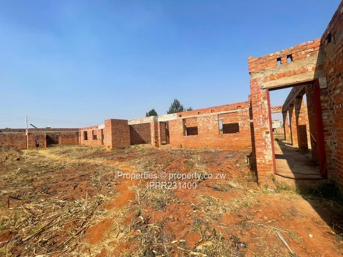 Spacious 2,000m² Corner Stand with Incomplete Multi-Unit Development