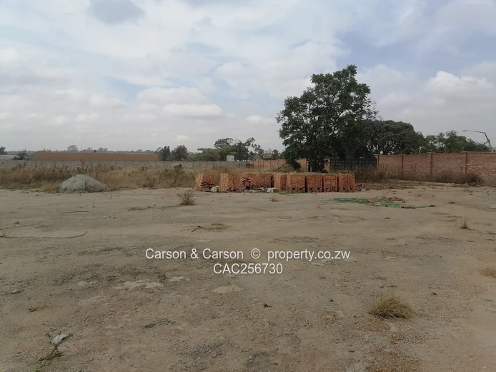8001m² Walled Commercial Land — Main Road, Ardbennie, Harare South