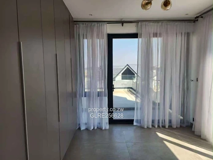Borrowdale: Modern 4-Bed Apt w/ Glass Balconies & Borehole