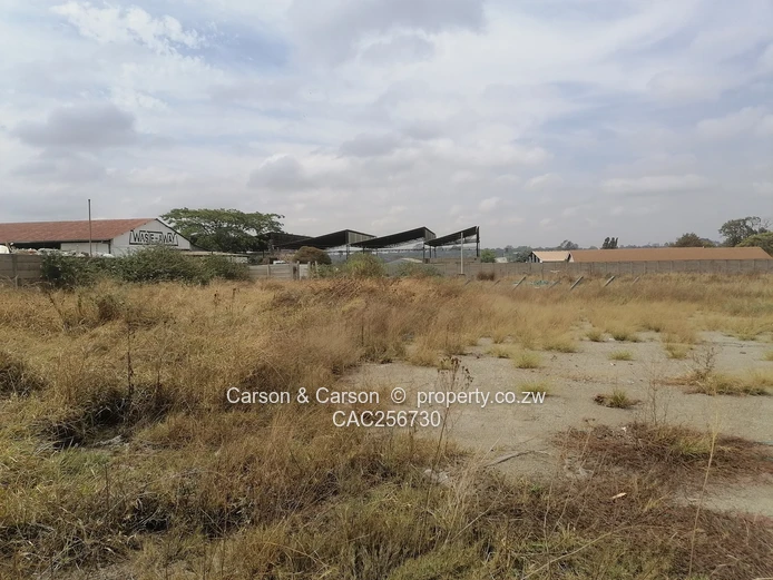 8001m² Walled Commercial Land — Main Road, Ardbennie, Harare South