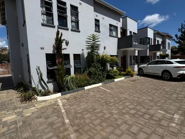 Garden-View Living Stylish 3-Bedroom Apartment with Modern Finishes