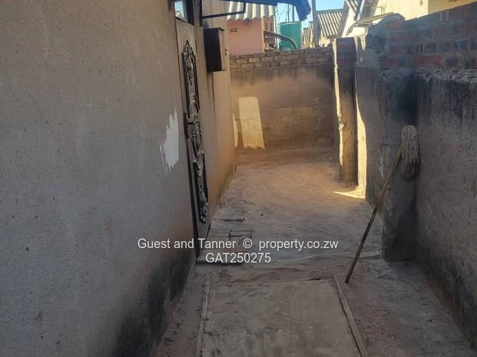 A neat 7-roomed, 4-bedroom house sitting on 200m², ideal for a family or as an investment property.