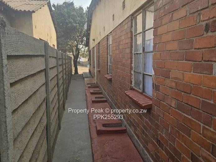 11-Bedroom Brick Home in Mbare — Walled, Main Road Deeds available