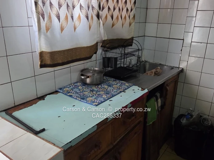 Mufakose 2 bedroom flat lounge fitted kitchen combined toilet and bathroom on ground floor 