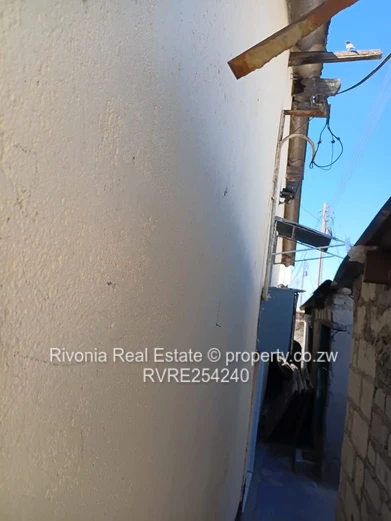 Walled 4-Bed Brick Home in Chitungwiza — Secure Verandah