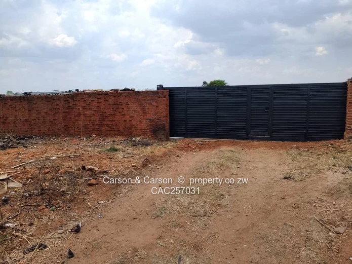 Walled 3800 m² Industrial Site in Chitungwiza — Gate & Gravel Access