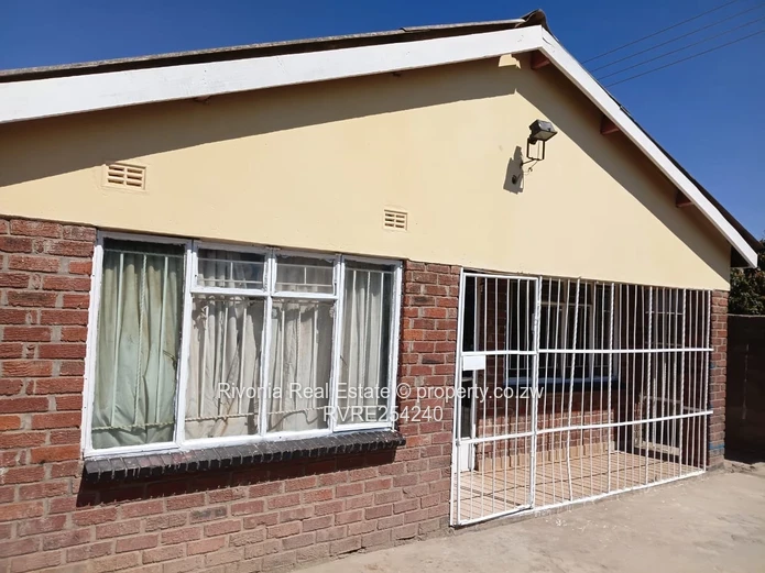 Walled 4-Bed Brick Home in Chitungwiza — Secure Verandah