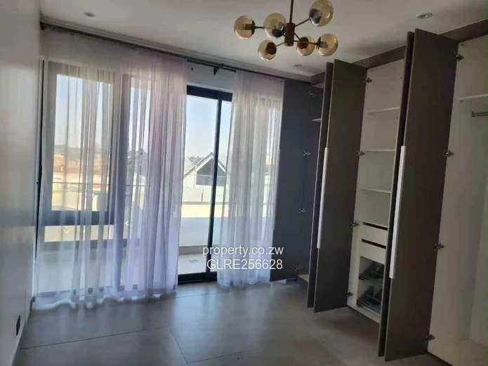 Borrowdale: Modern 4-Bed Apt w/ Glass Balconies & Borehole