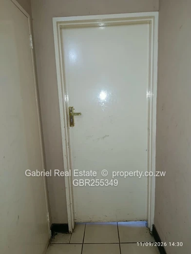 Prime Masvingo CBD Office/flat currently being used as a Driving school, Car wash and restaurant.