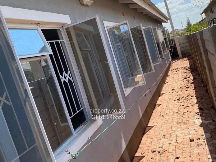 For Sale 4-Bed 2 Apartments Townhouse Complex in Budiriro Cabs  - Walled, Paved, Fitted Kitchens