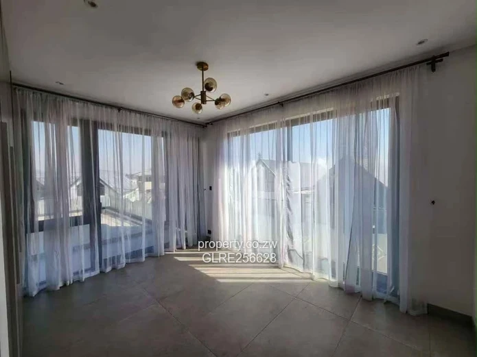 Borrowdale: Modern 4-Bed Apt w/ Glass Balconies & Borehole