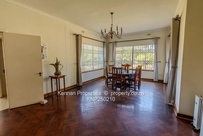 Attractive five bedroom home on two and a half acres. Good water and Msasa trees. (Sole Mandate)