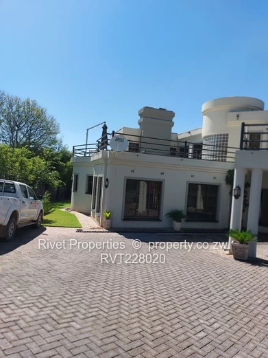 **Stylish 4-Bedroom House with Borehole in Exclusive Borrowdale Brook**