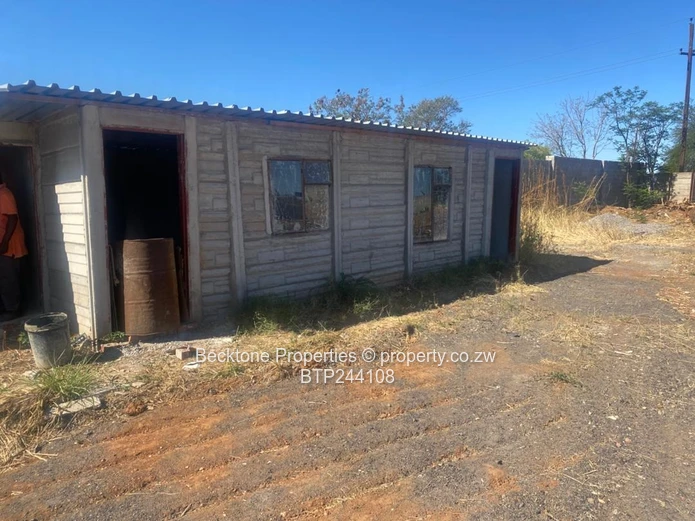 Spacious 2,420m² Walled Industrial Yard with Workshop — Bulawayo CBD
