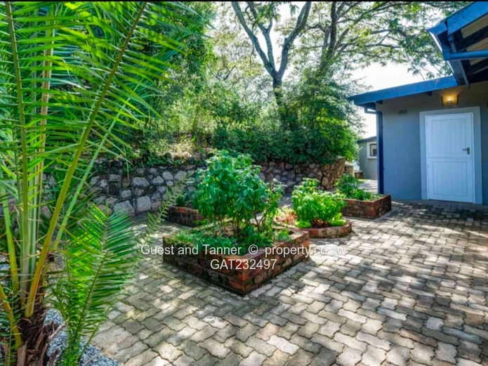 Luxury Safari-Style 4-Bedroom House with Cottage, Pool, Borehole, and Smart Home Features for Sale