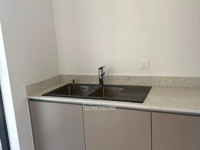 Contemporary 4-Bed Borrowdale Apt — Balcony & Borehole